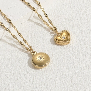Golden titanium steel necklaces featuring star-patterned heart and round pendants with zircon