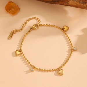 Bracelet raffiné en acier inoxydable plaqué or 18k avec cœurs et zircons brillants