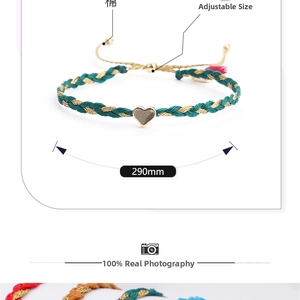 Detail of green and gold braided friendship bracelet with gold heart and 290mm slider