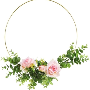 Elegant gold metal floral hoop with pink artificial roses and green eucalyptus leaves