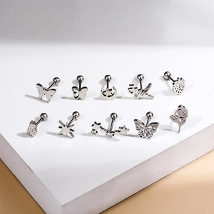 Set of 10 stainless steel screw back earrings with star, moon, and flower shapes