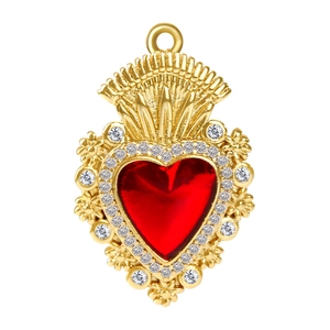 Macro detail of gold-plated sacred heart pendant with red crystal and sparkling zircons
