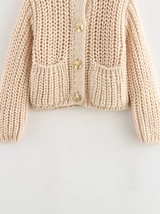 Chunky knit beige cardigan for women with gold geometric buttons and dual front pockets