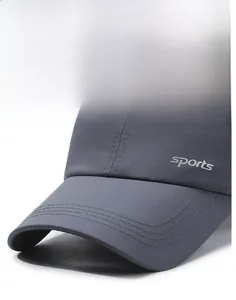 Close-up of dark grey sports cap featuring breathable fabric and side sports embroidery