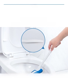 Detail of ergonomic long-handled toilet brush with rounded edges and blue sponge head