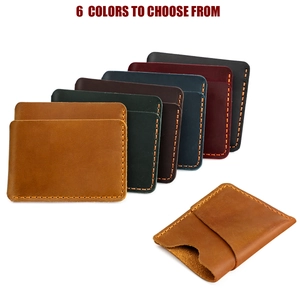 Stack of crazy horse leather card holders in six vintage colors with contrast stitching
