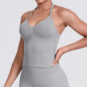 Detail of light gray ruched seamless sports bra with elastic ribbed hem for yoga