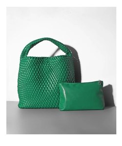 Macro detail of green woven bucket bag with matching inner pouch and leather texture