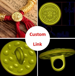 Detailed view of 14.3mm vintage gold relief charm with traditional mask engraving