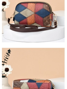 Close-up of geometric patchwork crossbody bag with textured leather and gold hardware