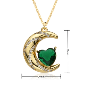 Detail view of gold sun moon pendant with green heart stone and 25mm x 20mm dimensions