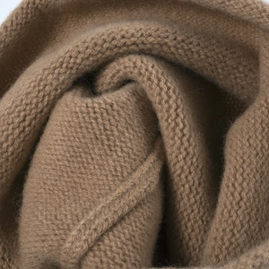 Winter merino wool knitted slouchy beanie for women in warm camel brown color