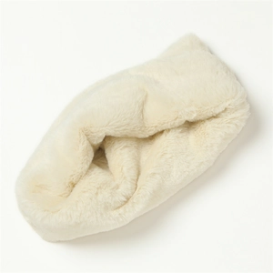 Close-up of soft faux rabbit fur neck warmer in cream white with plush texture details