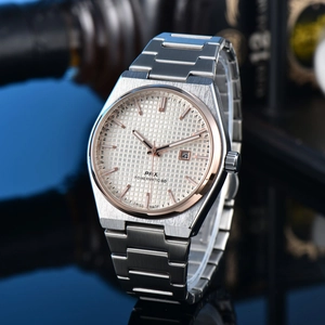 Detailed macro view of the silver waffle dial with rose gold markers and the PRX logo