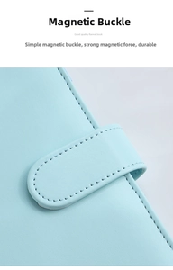 Detail shot of macaron blue leather notebook featuring magnetic buckle and neat stitching