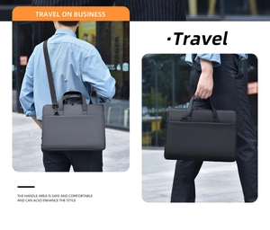 Detail showing reinforced handles and detachable shoulder strap on grey laptop bag