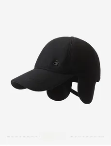Detail of winter baseball cap with ear protection flaps and a metal Sport emblem