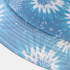 Blue tie-dye cotton bucket hat featuring reinforced brim stitching and fabric texture