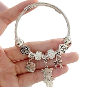 Silver beaded bracelet with bear heart and bow charms featuring I love you engraving
