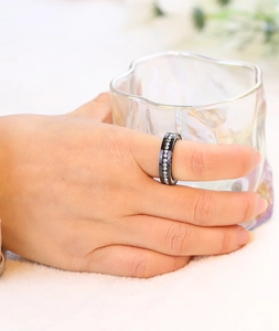Detail showing the 6mm black stainless steel ring with full pavé set cubic zirconia