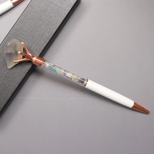 White crystal ballpoint pen with rose gold accents and healing gemstone in a gift box
