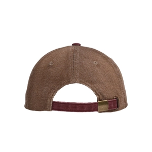 Detail of retro washed canvas baseball cap showing contrast strap and metal buckle