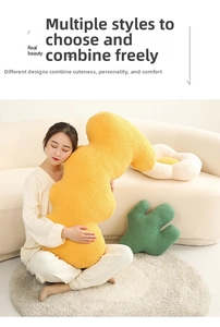 Detail showing plush floral and cactus pillows in a cozy home setting for sofa decor