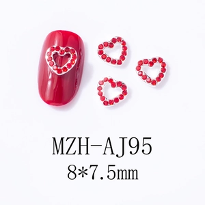 Macro shot of red hollow heart nail art charms with rhinestones, 8x7.5mm alloy metal studs