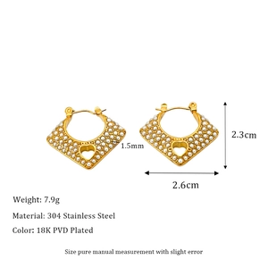 Detail view of heart-shaped pearl earrings with 18k gold plating and size dimensions