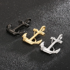 Detailed close-up of anchor pendants in black, gold, and silver stainless steel