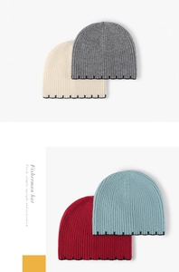 Detailed view of rib-knit fisherman hats showing black dotted stitch edge in four colors