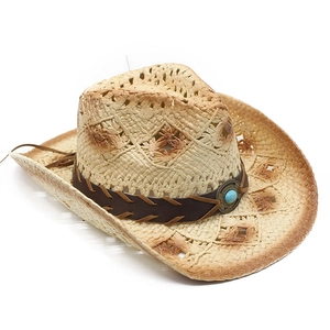 Detail of hand-woven straw cowboy hat featuring hollow ventilation and turquoise bead band