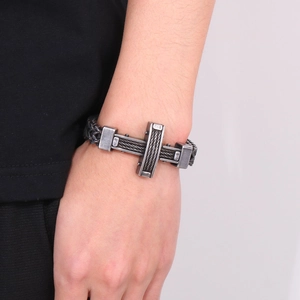 Macro shot of industrial steel cable bracelet with magnetic clasp and S925 engraving detail