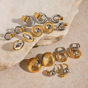 Exaggerated two-tone gold and silver stainless steel earrings set on natural stones