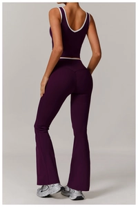 Detail of cross high-waisted yoga set with backless sports bra and purple flared pants