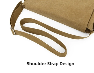 Detail of adjustable khaki canvas shoulder strap with sturdy metal buckle on a crossbody bag