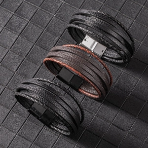 Macro detail of multilayer braided leather bracelets with stainless magnetic clasps