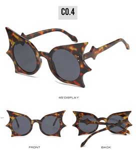 Three-angle view of oversized bat wing sunglasses with tortoise shell frames and grey lenses