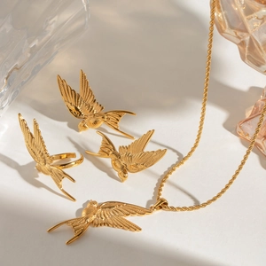 Golden peace dove jewelry set with necklace ring and earrings in a luxury bird design