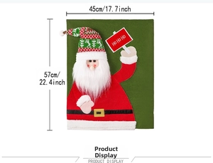 Detail of Santa Claus chair cover with green felt background and HO HO HO embroidery
