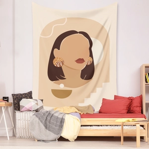 Detail view of abstract bohemian wall tapestry in a cozy bedroom with warm beige tones