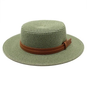 Detail of sage green straw boater hat featuring a brown faux leather belt with buckle