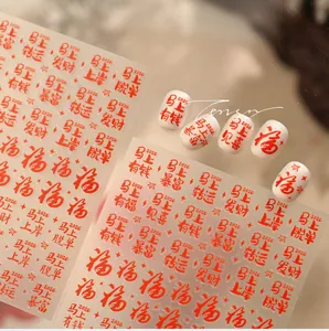 Macro detail of 2026 Lunar New Year red nail stickers with gold festive characters