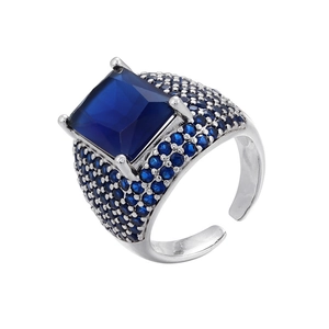 Macro shot of silver open ring featuring a square blue gemstone with micro-pave crystals