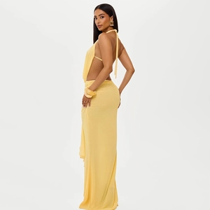 Detail of yellow backless cowl neck top and maxi skirt set with soft draped fabric