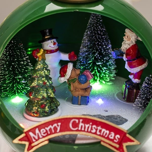 Luminous Christmas music box with Santa and snowman scenes inside a green globe