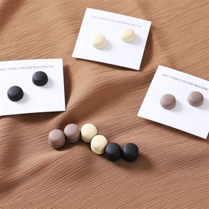 Three pairs of matte round no-snag hijab magnets in black, beige, and brown colors