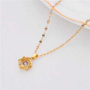 Close-up of star pendant necklace with purple zircon and 18K rose gold plating