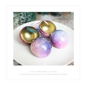 Macro view of purple star-themed tin candy boxes with ribbons on snowy pine branches