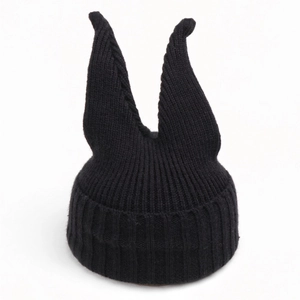 Winter children's black knitted hat with long devil horns and ribbed warm ear protection